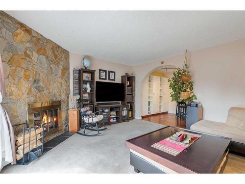 17 Ranch Glen Drive Nw, Calgary, AB - Indoor Photo Showing Living Room With Fireplace