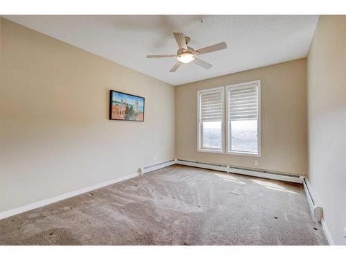 306-207 Sunset Drive, Cochrane, AB - Indoor Photo Showing Other Room