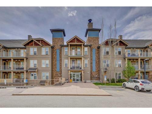 306-207 Sunset Drive, Cochrane, AB - Outdoor With Facade