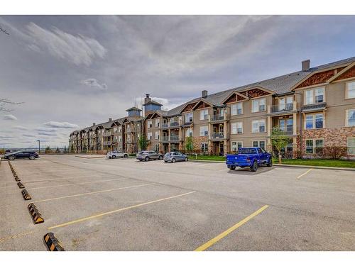 306-207 Sunset Drive, Cochrane, AB - Outdoor With Facade