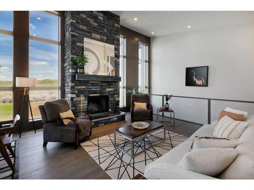 10, 20 --274172 112 Street West, Rural Foothills County, AB - Indoor Photo Showing Living Room With Fireplace