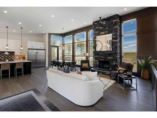 10, 20 --274172 112 Street West, Rural Foothills County, AB - Indoor Photo Showing Living Room With Fireplace