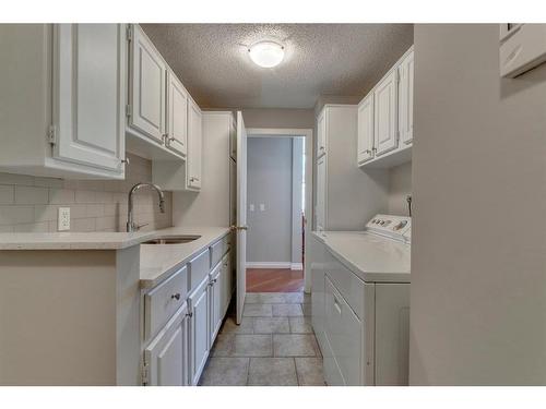 395 Canterville Drive Sw, Calgary, AB - Indoor Photo Showing Laundry Room