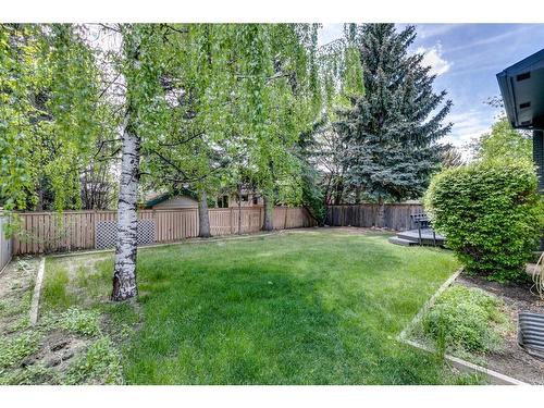 395 Canterville Drive Sw, Calgary, AB - Outdoor With Backyard