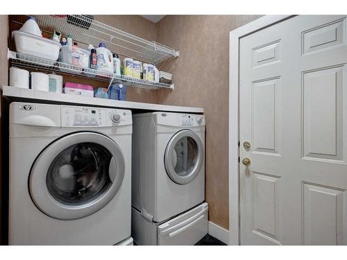 1057 Cranston Drive Se, Calgary, AB - Indoor Photo Showing Laundry Room