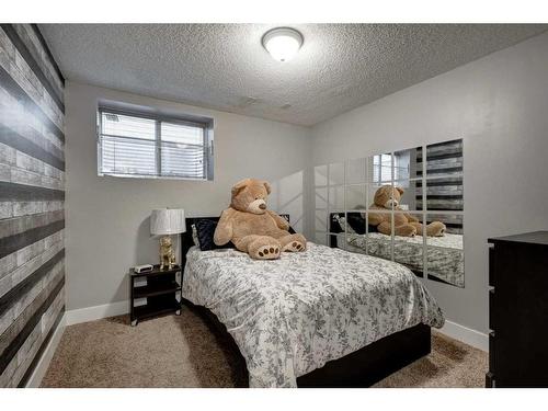 1057 Cranston Drive Se, Calgary, AB - Indoor Photo Showing Bedroom