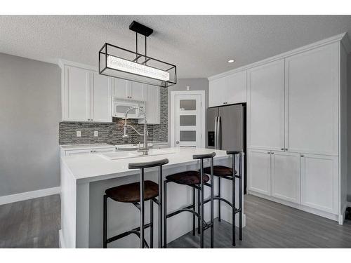 1057 Cranston Drive Se, Calgary, AB - Indoor Photo Showing Kitchen With Double Sink
