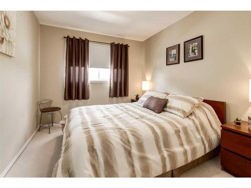 235 Rocky Ridge Drive Nw, Calgary, AB - Indoor Photo Showing Bedroom