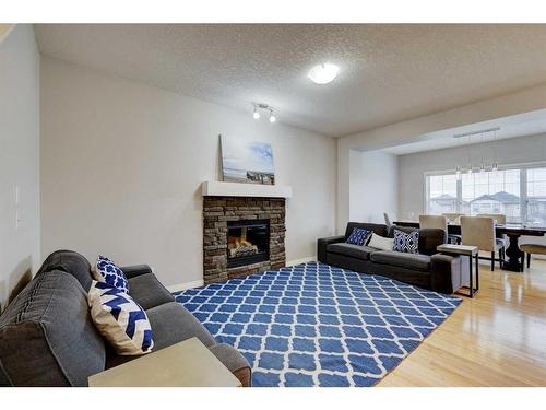215 Kincora Glen Mews Nw, Calgary, AB - Indoor Photo Showing Living Room With Fireplace