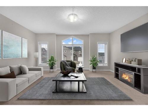 176 Skyview Shores Manor Ne, Calgary, AB - Indoor Photo Showing Living Room With Fireplace