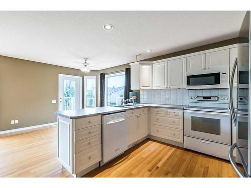 411 Lineham Acres Bay Nw, High River, AB - Indoor Photo Showing Kitchen With Double Sink