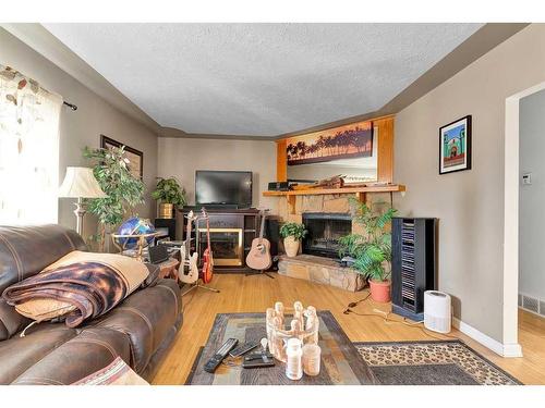 372 Northmount Drive Nw, Calgary, AB - Indoor Photo Showing Living Room With Fireplace