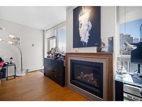 2026-222 Riverfront Avenue Sw, Calgary, AB - Indoor Photo Showing Living Room With Fireplace
