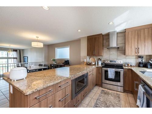 67 Masters Link Se, Calgary, AB - Indoor Photo Showing Kitchen With Stainless Steel Kitchen