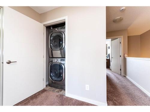 67 Masters Link Se, Calgary, AB - Indoor Photo Showing Laundry Room
