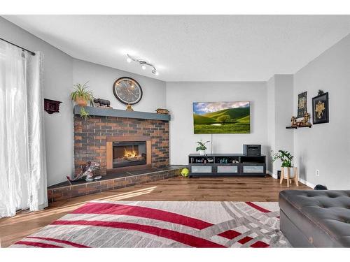 100 Martindale Crescent Ne, Calgary, AB - Indoor Photo Showing Living Room With Fireplace