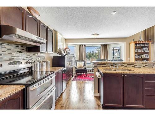 470 Millrise Square Sw, Calgary, AB - Indoor Photo Showing Kitchen With Double Sink