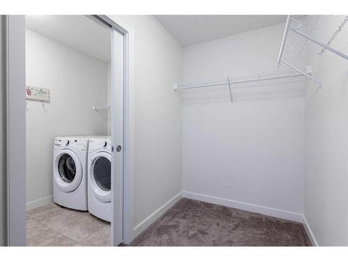 32 Walden Green Se, Calgary, AB - Indoor Photo Showing Laundry Room