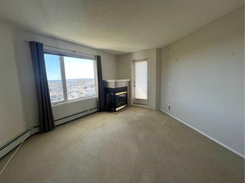 #2307-950 Arbour Lake Road Nw, Calgary, AB - Indoor With Fireplace
