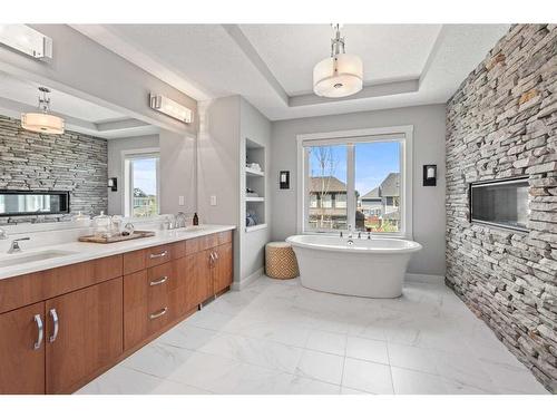 361 Auburn Shores Landing Se, Calgary, AB - Indoor Photo Showing Bathroom With Fireplace