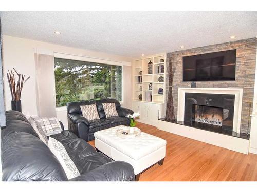 3403 23 Street Nw, Calgary, AB - Indoor Photo Showing Living Room With Fireplace