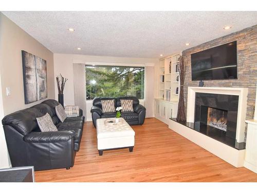 3403 23 Street Nw, Calgary, AB - Indoor Photo Showing Living Room With Fireplace