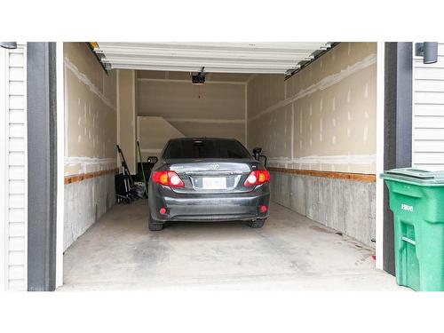 644 Southpoint Heath Sw, Airdrie, AB - Indoor Photo Showing Garage