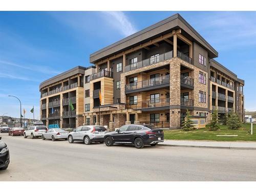 412-55 Wolf Hollow Crescent Se, Calgary, AB - Outdoor With Balcony With Facade