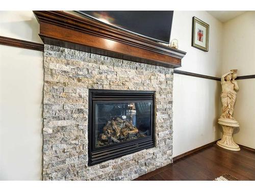 751 New Brighton Drive Se, Calgary, AB - Indoor Photo Showing Living Room With Fireplace