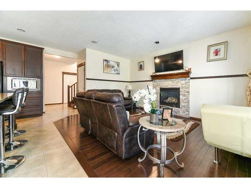 751 New Brighton Drive Se, Calgary, AB - Indoor Photo Showing Living Room With Fireplace