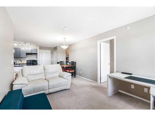 404-15 Saddlestone Way Ne, Calgary, AB - Indoor Photo Showing Living Room