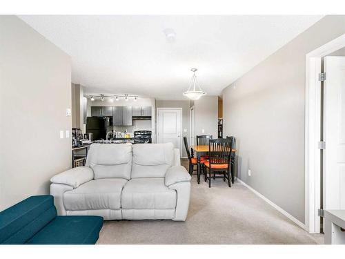 404-15 Saddlestone Way Ne, Calgary, AB - Indoor Photo Showing Living Room