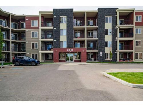 404-15 Saddlestone Way Ne, Calgary, AB - Outdoor With Balcony With Facade