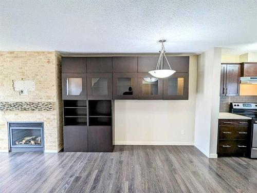 425 Coperpond Landing Se, Calgary, AB - Indoor With Fireplace