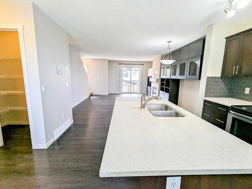 425 Coperpond Landing Se, Calgary, AB - Indoor Photo Showing Kitchen With Double Sink