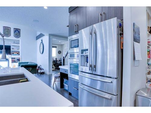 249 Kinniburgh Boulevard, Chestermere, AB - Indoor Photo Showing Kitchen With Stainless Steel Kitchen With Double Sink