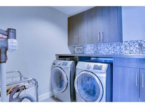 249 Kinniburgh Boulevard, Chestermere, AB - Indoor Photo Showing Laundry Room