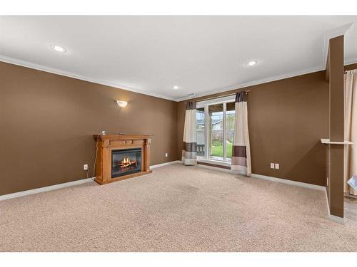 2212 12 Avenue, Didsbury, AB - Indoor With Fireplace