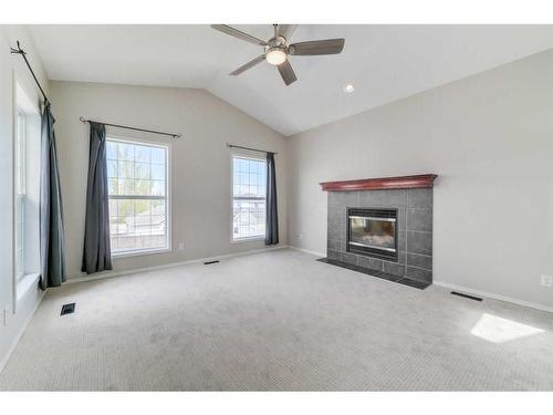 19 Prestwick Heath Se, Calgary, AB - Indoor Photo Showing Living Room With Fireplace