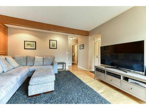 840 Suncastle Road Se, Calgary, AB - Indoor Photo Showing Living Room With Fireplace