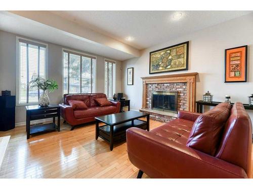 840 Suncastle Road Se, Calgary, AB - Indoor Photo Showing Living Room With Fireplace