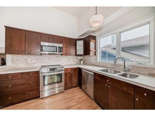 12 Stratton Hill Rise Sw, Calgary, AB - Indoor Photo Showing Kitchen With Double Sink