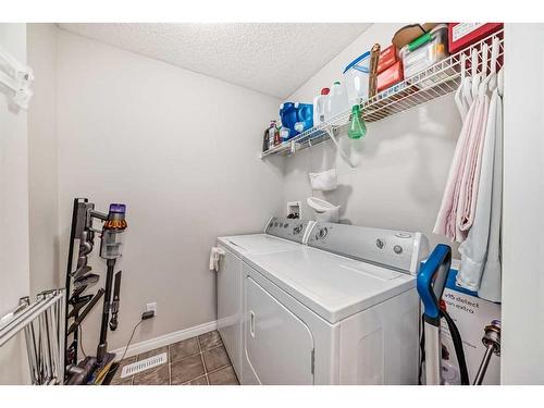 109 Cougar Plateau Mews Sw, Calgary, AB - Indoor Photo Showing Laundry Room