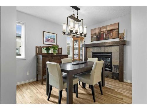 118 Auburn Glen Drive Se, Calgary, AB - Indoor Photo Showing Dining Room With Fireplace