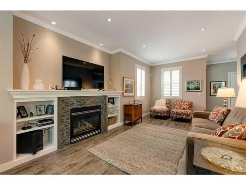 30 Discovery Heights Sw, Calgary, AB - Indoor Photo Showing Living Room With Fireplace