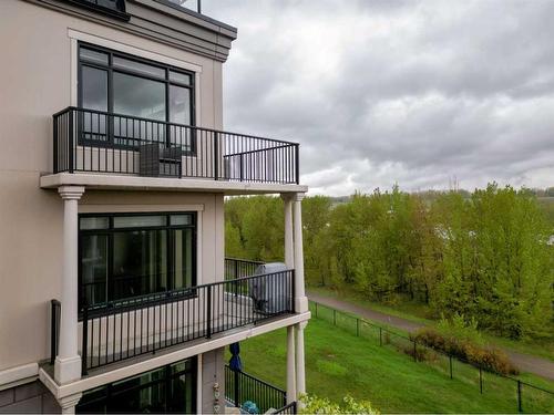 306-221 Quarry Way Se, Calgary, AB - Outdoor With Balcony