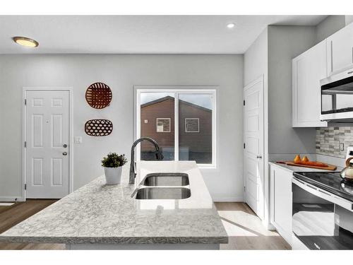 254 Aquila Way Nw, Calgary, AB - Indoor Photo Showing Kitchen With Double Sink