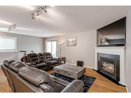 234 Bridlewood Road Sw, Calgary, AB - Indoor Photo Showing Living Room With Fireplace