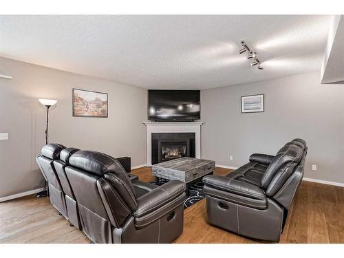 234 Bridlewood Road Sw, Calgary, AB - Indoor Photo Showing Living Room With Fireplace