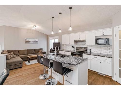 234 Bridlewood Road Sw, Calgary, AB - Indoor Photo Showing Kitchen With Double Sink With Upgraded Kitchen